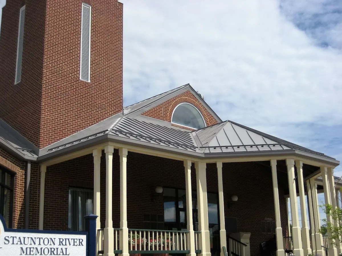 Skilled roofing craftsmen working on a residential roof in Bennett